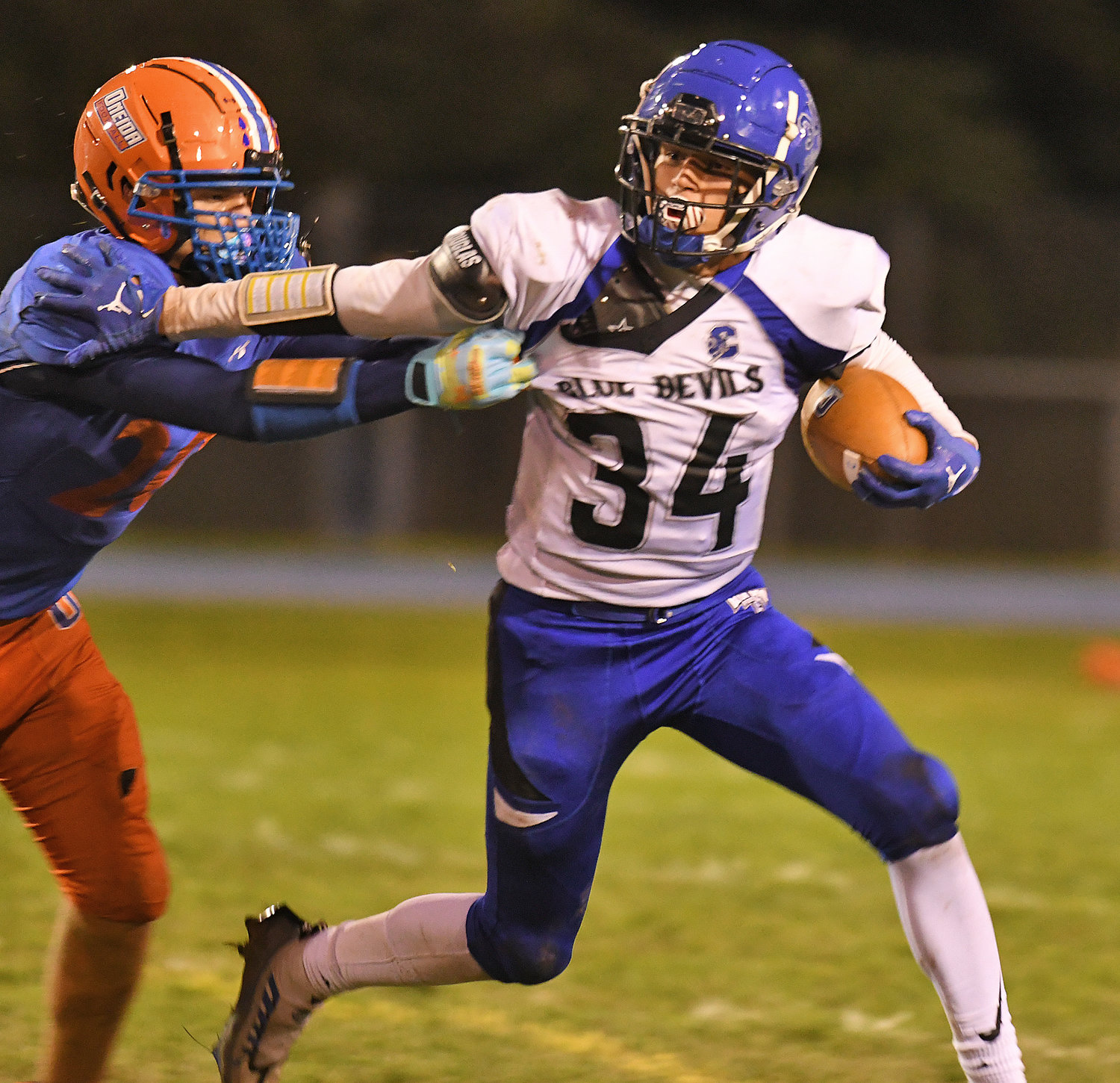 Camden's Noah Morse tries to elude Oneida's Austin DeGroat during a run in the first half Friday night in Oneida. Morse had 97 yards on 14 carries. Camden finished with 241 yards rushing led mostly by Morse, Trey Kimball and Connor Dean.