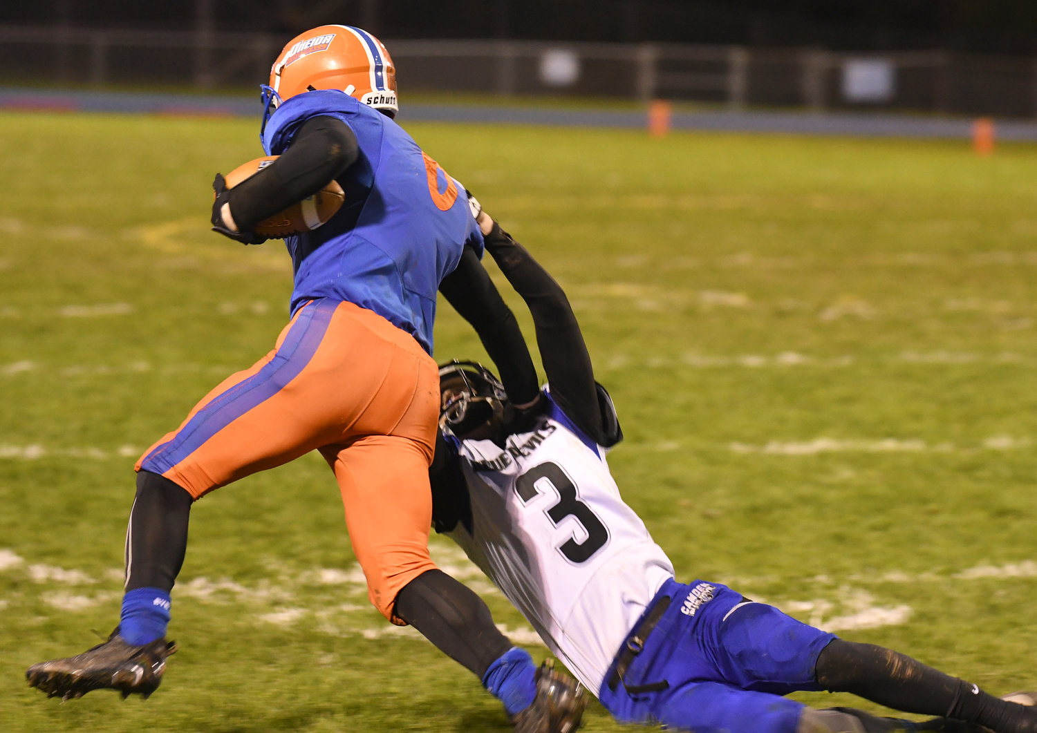 Oneida's Pierce Relyea Jr. sheds Camden's Trey O'Rourke after making an interception in the first quarter Friday night in Oneida.