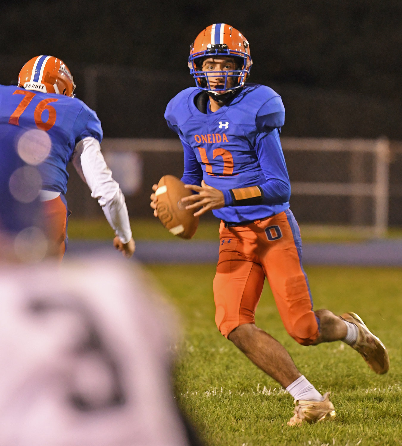 Oneida's Thomas Lacy looks down field in the first half against Camden Friday night at Oneida. Lacy recently moved into the quarterback position for Oneida.