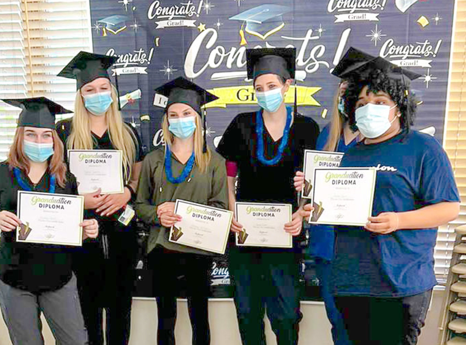 A group of those completing the certified nurses aide program at The Grand at Mohawk Valley, 99 Sixth Ave., in Ilion hold their diplomas in celebration on Thursday.