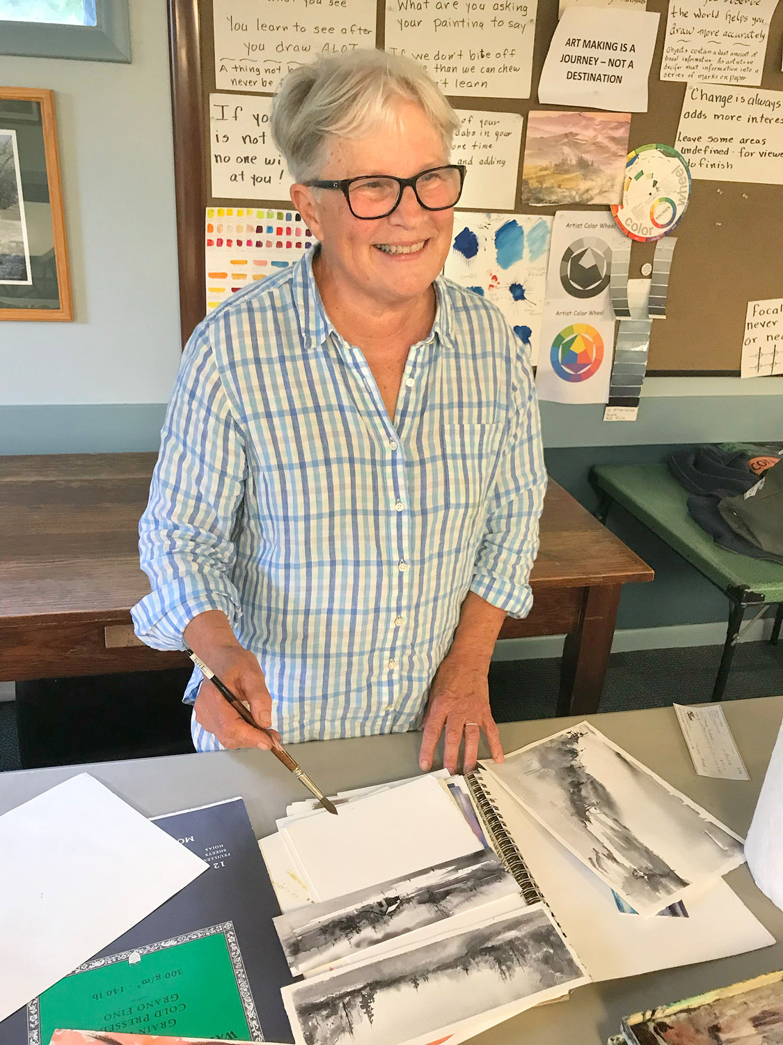Laura Diddle teaches her watercolor painting class Thursday at the Sherrill-Kenwood Free Library in Sherrill. She is one of several artists sharing their talents at the library in classes for the community.