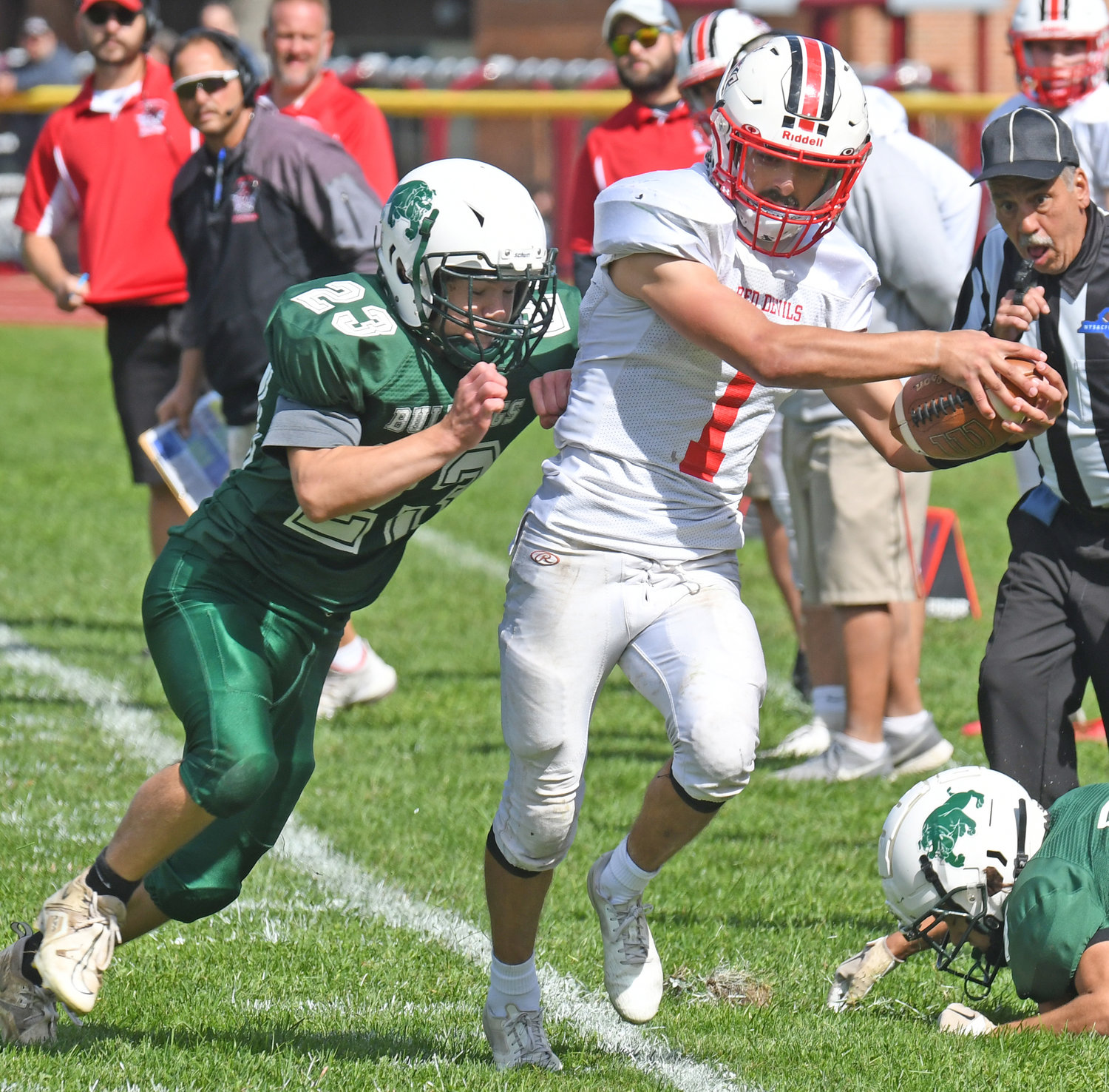Vernon-Verona-Sherrill's James Wheeler IV tip-toes down the sideline and stretches his arms out with the ball to pick up a first down as Westmoreland/Oriskany's Max Janczewski gets set to push him out of bounds on Saturday afternoon at Bernie Block Field in Oriskany. Wheeler rushed for 199 yards on 15 carries and scored three touchdowns as the Red Devils won 49-14.