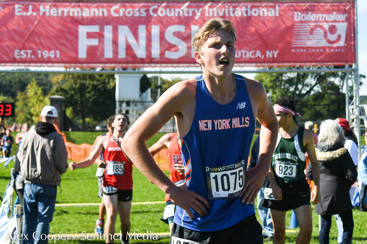 New York Mills runner Eli Pereira catches his breath after crossing the finish line during the 79th EJ Herrmann XC Invitational on Saturday, Sept. 24 at Proctor Park in Utica.