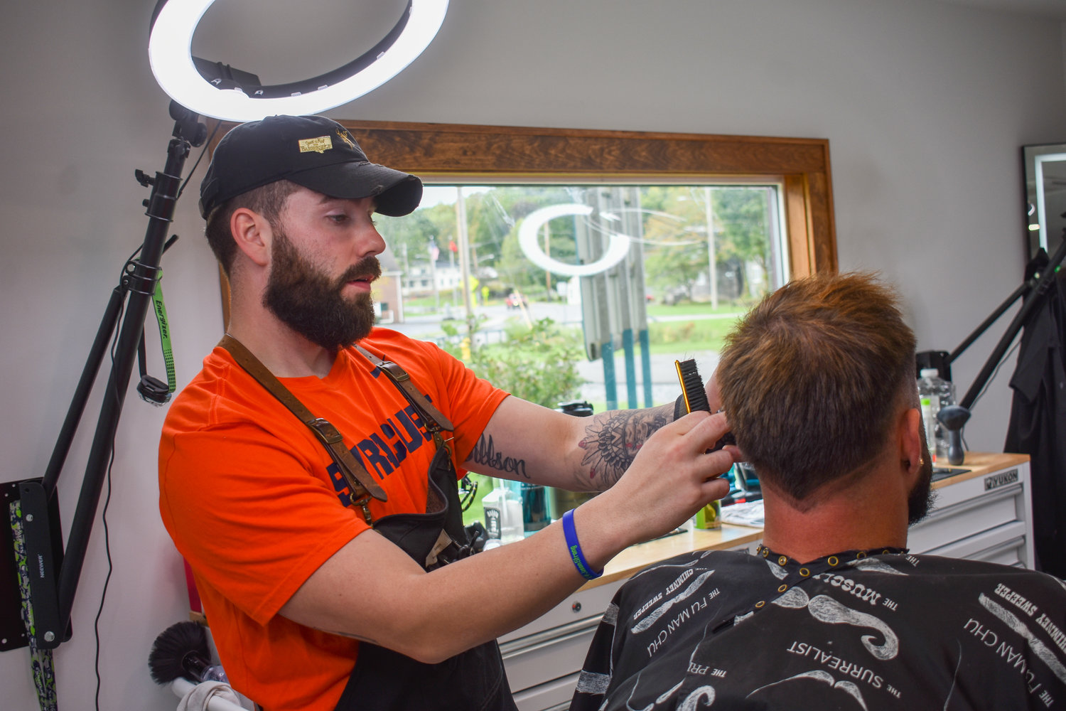 Jared Jillson puts some finishing touches on one of his clients. He's been practicing barbering since he was 15 and now does so professionally out of his business, Clifford's Barber Co., located at 44 Milford Street, Hamilton.