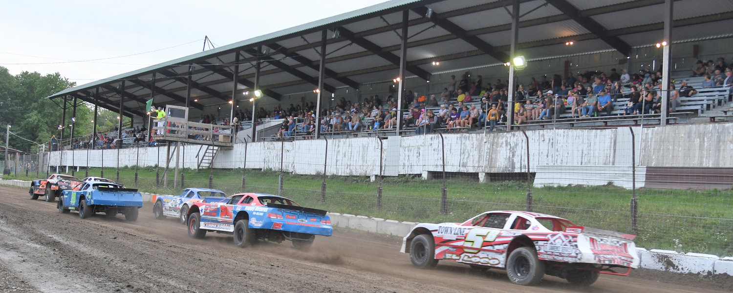 Pro stocks power down the front stretch in front of the old wooden Brookfield Speedway grandstand covered with a corrugated metal roof on September 10. The track benefitted from Utica-Rome Speedway promoter Brett Deyo and track groomer Jamie Friesen with plans for a schedule in 2023.