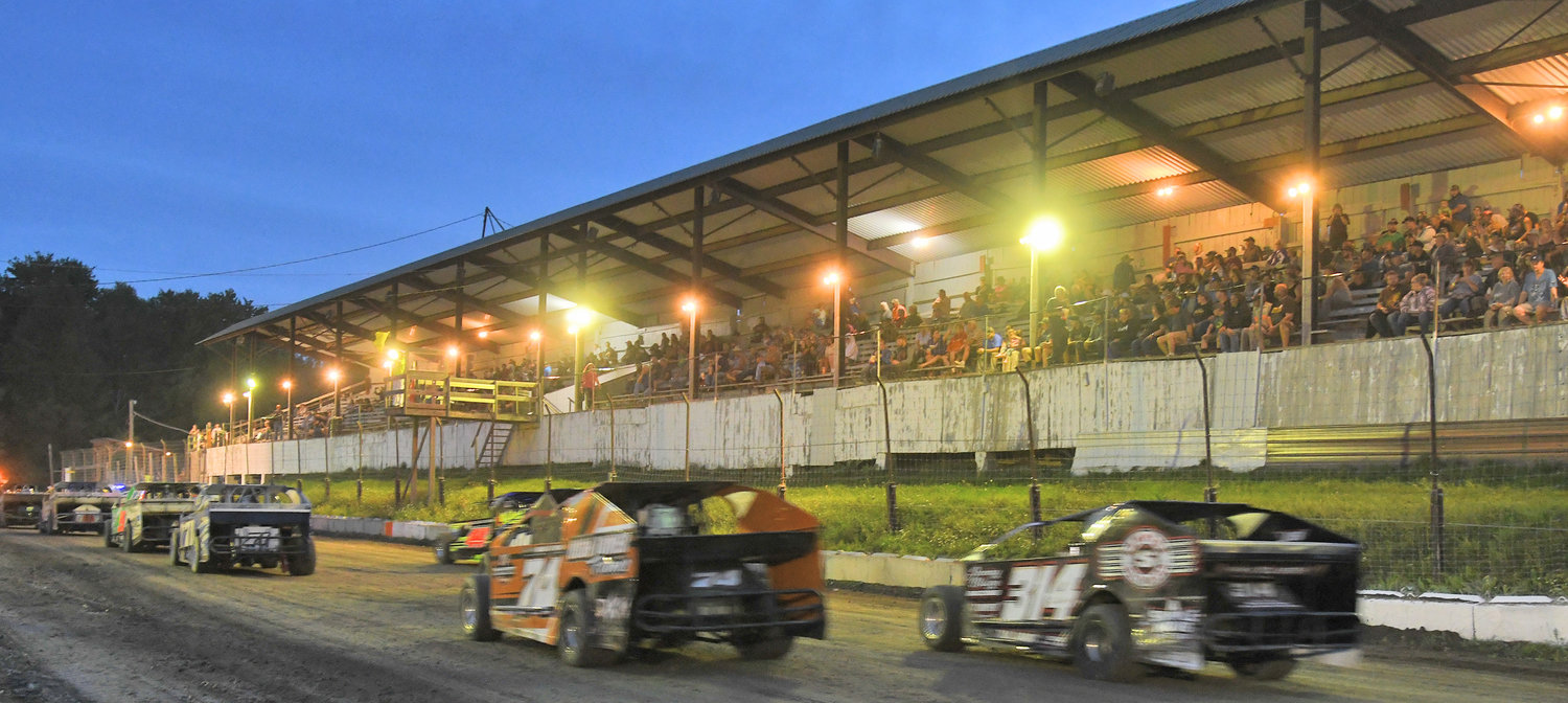 Sportsman cars parade in front of race fans seated in the old wooden Brookfield grandstand covered with a corrugated metal roof on September 10. The track benefitted from Utica-Rome Speedway promoter Brett Deyo and track groomer Jamie Friesen with plans for a schedule in 2023.