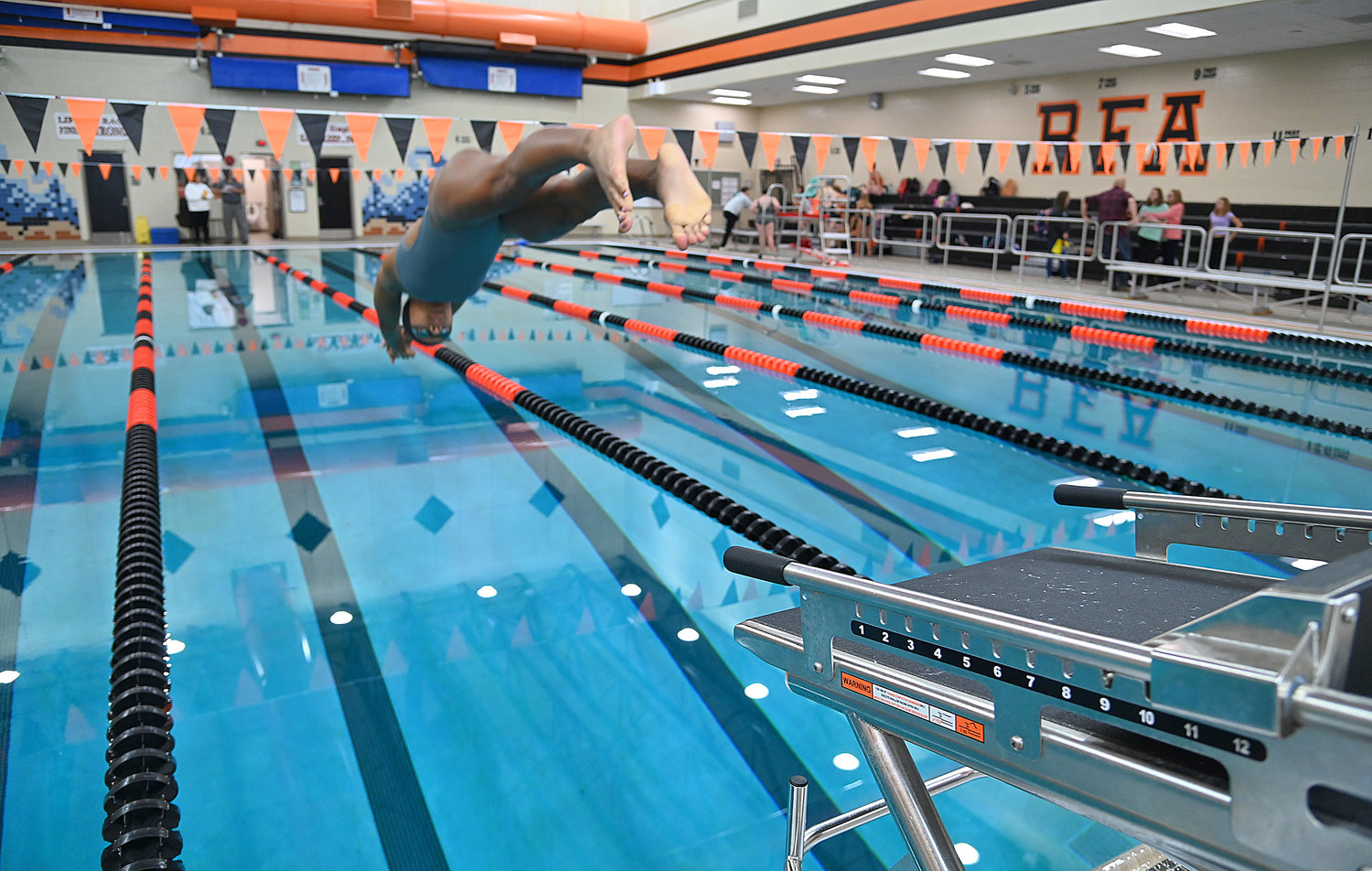 Rome Free Academy swimmer Imani Pugh dives in the pool on the new starting blocks Wednesday at RFA high school.