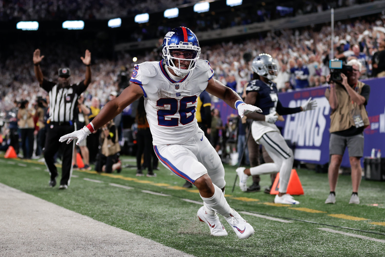 New York Giants running back Saquon Barkley reacts after scoring a touchdown against the Dallas Cowboys during on Monday night in East Rutherford, N.J.