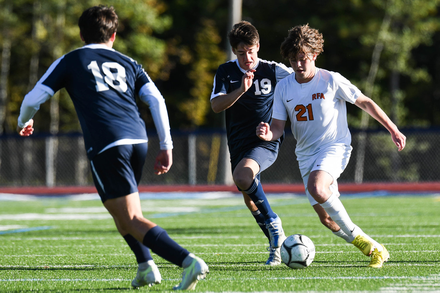 Rome Free Academy's Jack Rushton, right, moves the ball up the field as Central Valley Academy's Ryan Donahue (18) and Colin Cave (19) defend during the game on Thursday in Ilion. RFA won 2-0.