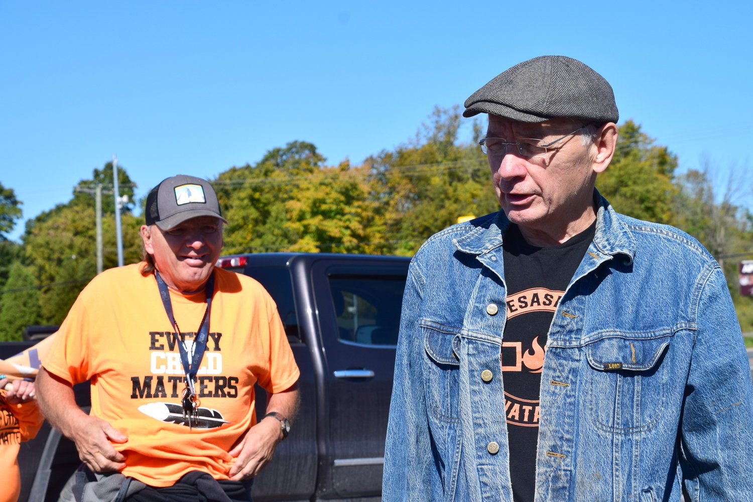 Residential school survivor Doug Kanentiio George, right, helped organize last Saturday’s march from Akwesasne to Trinity Anglican Church in Ontario to call for access to all records related to the Mohawk Institute.