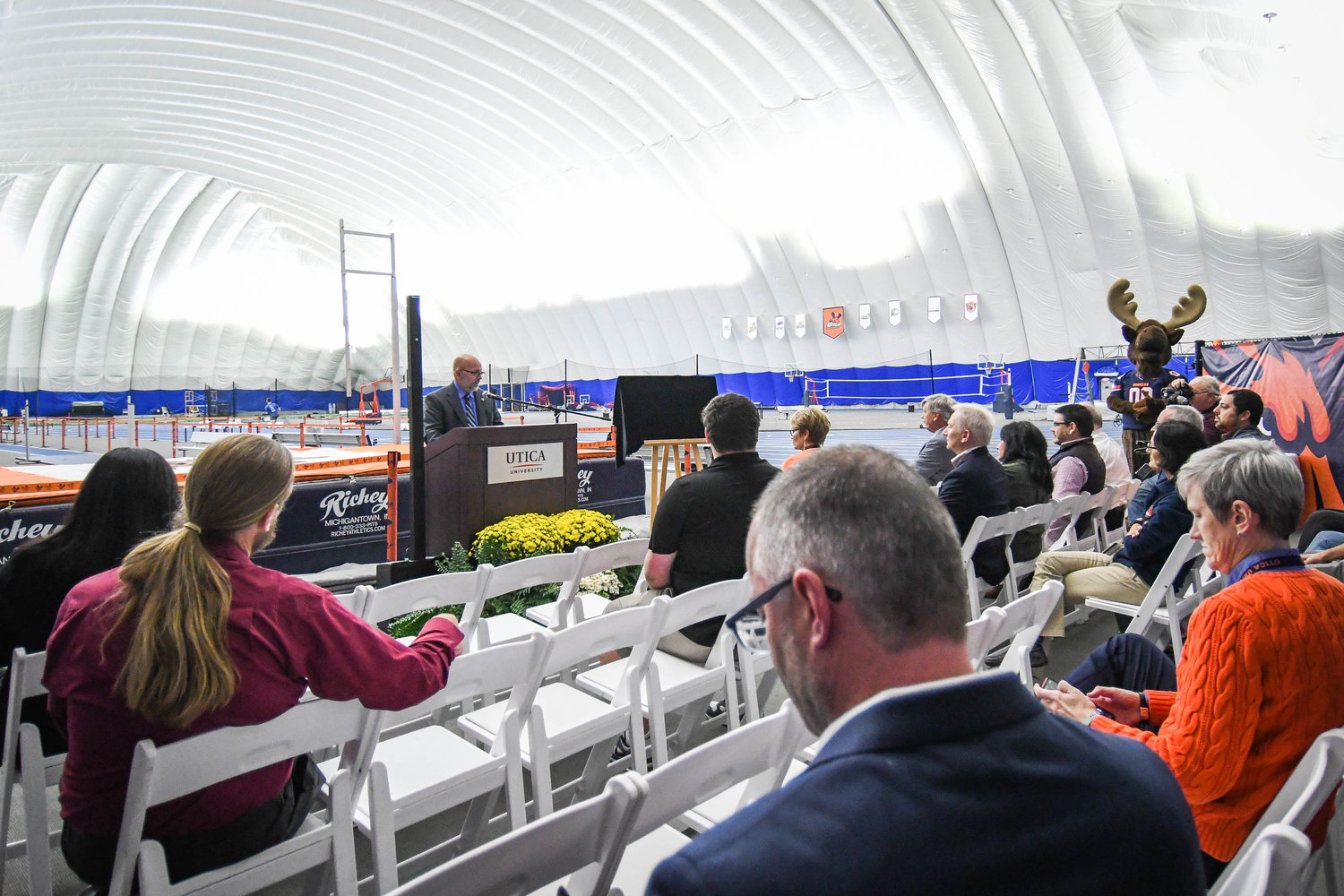 A dedication ceremony is conducted for the Lotis Howland Track on Friday at the Todd and Jen Hutton Sports & Recreation Center at Utica University.