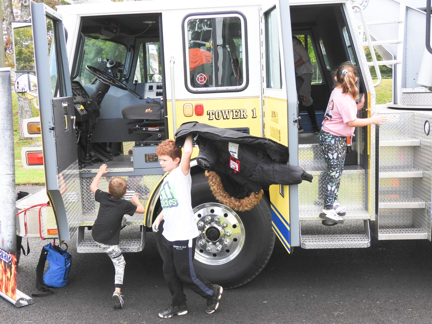 Children get a look at an Oneida Fire Department fire truck at the second annual Oneida Fall Fest on Saturday, Oct. 1.