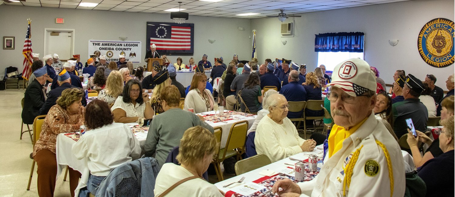 Dozens of area residents pack the banquet hall at Oriskany Post 1448 for an official visit by New York State American Legion Commander David R. Riley, Sr., of Rome, on Sunday, Oct. 2. During his remarks, Riley highlighted legion programs to help reduce the number of veteran suicides.