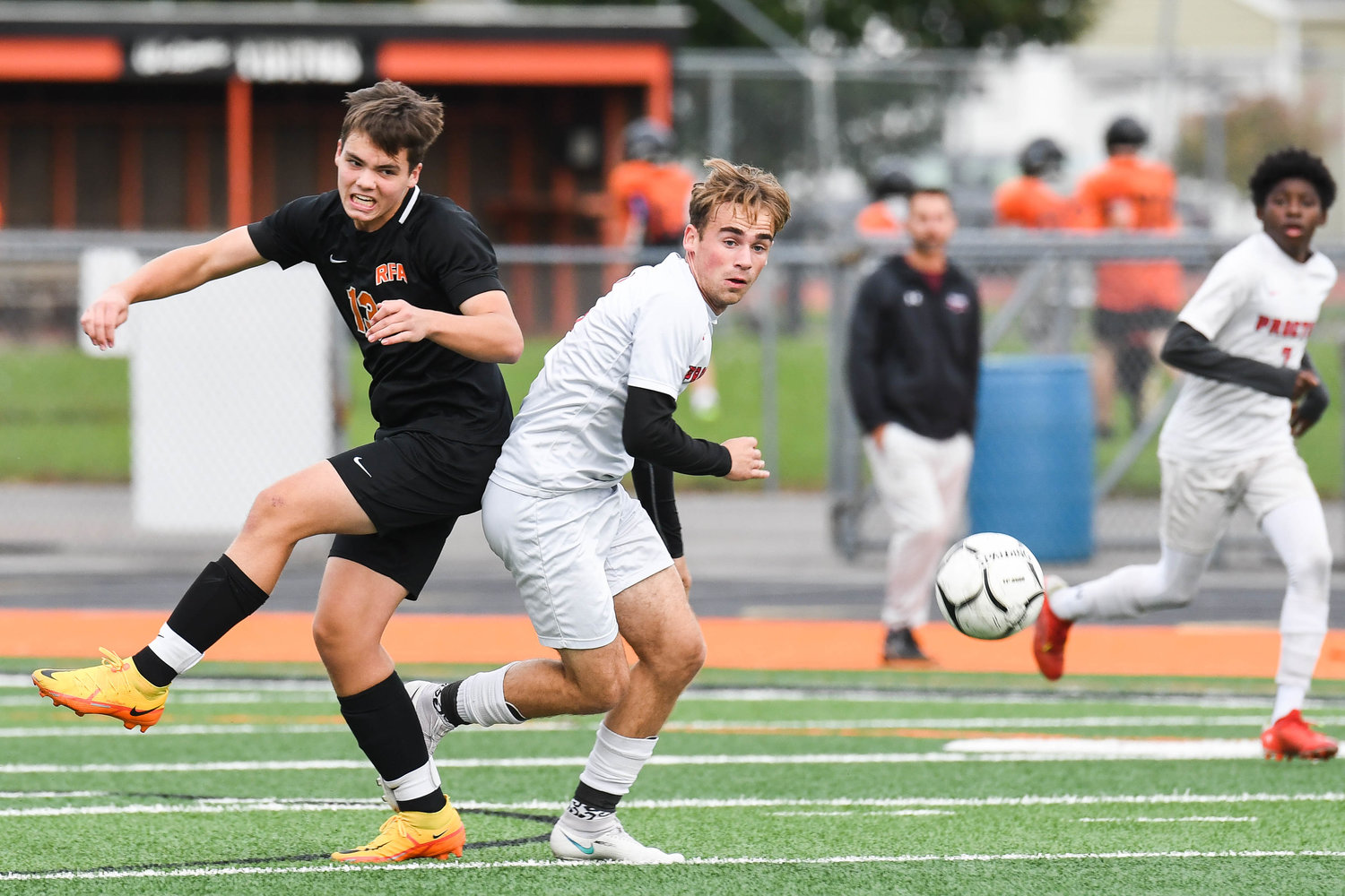 Rome Free Academy's Cooper Engelbert, left, and Proctor player Andrew Dischiavo fight for control of a loose ball during the game on Tuesday at RFA Stadium. Proctor won 4-0.