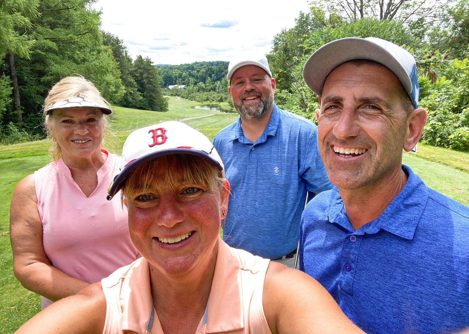 Officer William Preuss likes to spend his free time on the golf course. From left to right: Ada Sue Paratore, Kristen Drake, William Preuss, and Rob Drake.