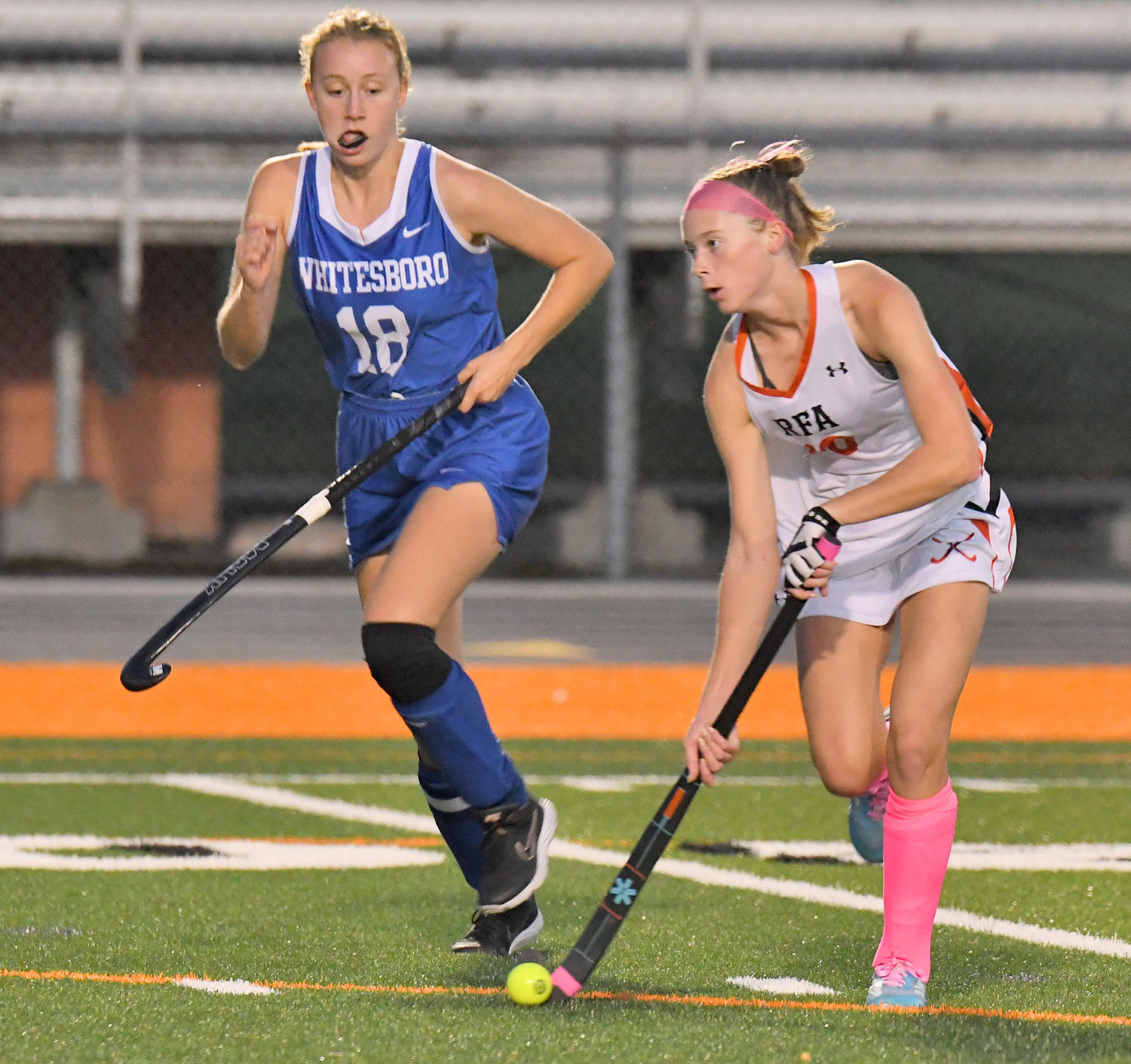 Rome Free Academy's Fiona McMahon looks downfield with Whitesboro's Riley Collis in pursuit in the first half at RFA Stadium Wednesday night. RFA won 8-0 and McMahon had one of the goals.