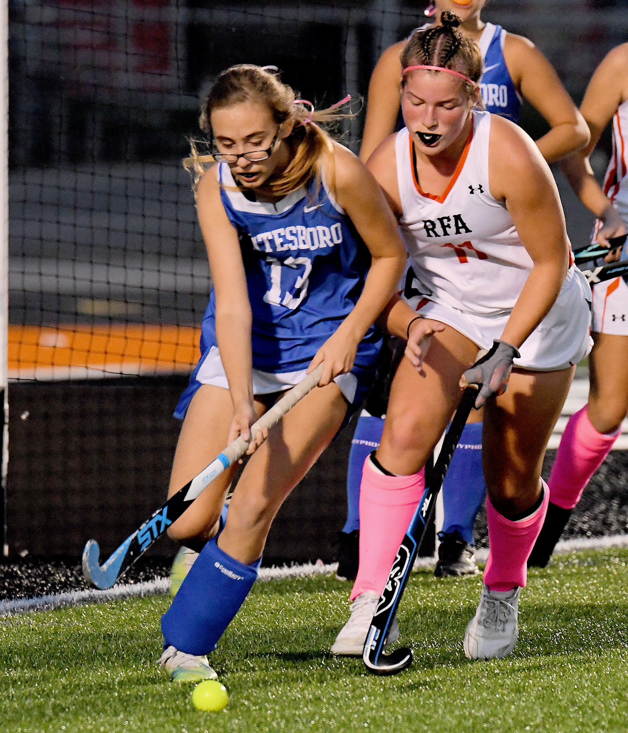 Avery Davis of Whitesboro tries to clear the ball from the Blue Devils' goal with Rome Free Academy's Hannah Lowder looking to get the ball back in the first half at RFA Stadium Wednesday night. RFA won 8-0 and Lowder scored once.
