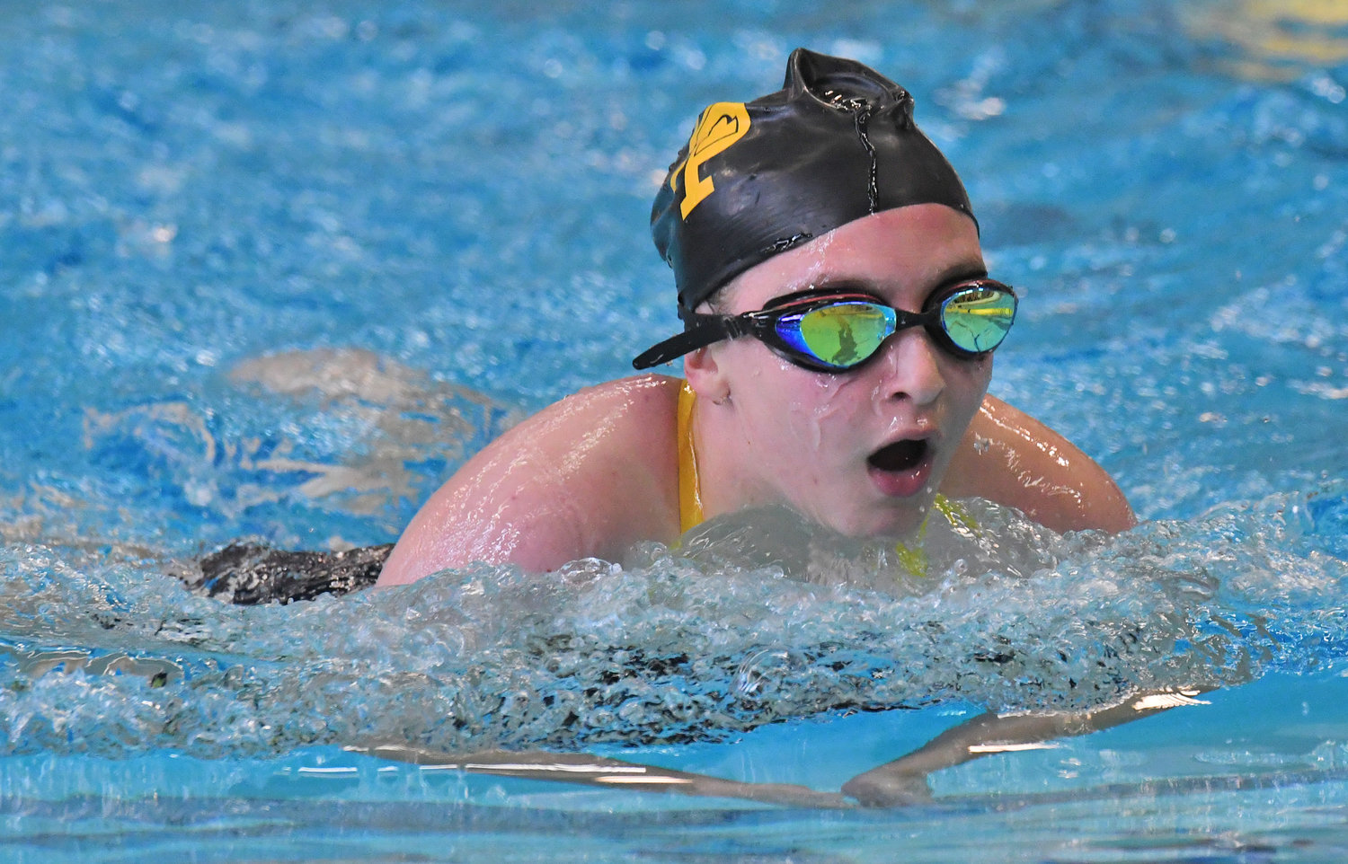 Holland Patent individual medley swimmer Sarah Bangs does the breast stroke in the third leg of the event Thursday afternoon against Rome Free Academy in Holland Patent. Bangs was third in the event.