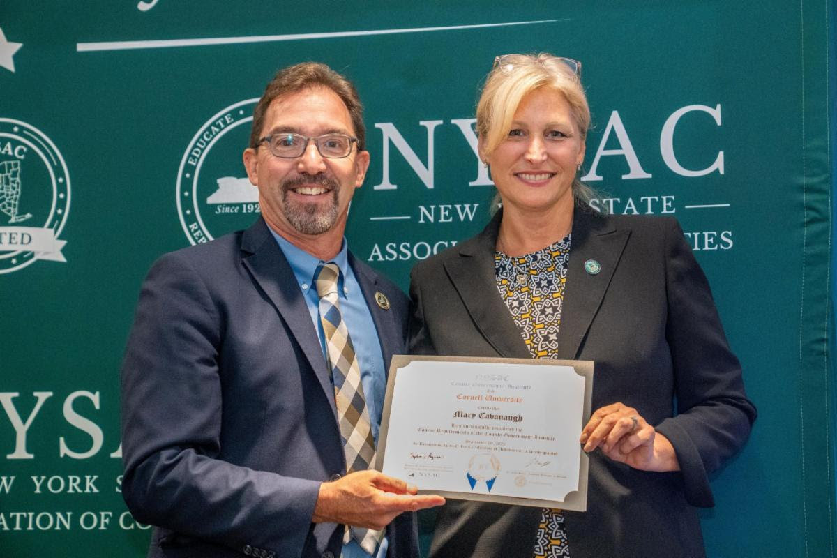 Madison County Supervisor Mary Cavanagh, left, poses recently with NYSAC Deputy Director Mark LaVigne upon receiving her certificate for completing the County Government Institute.(Photo submitted)