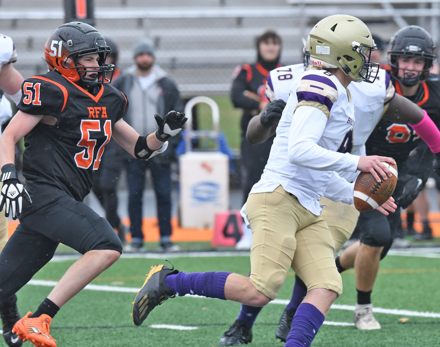 Rome Free Academy defensive lineman Kaiden Patnode chases Christian Brothers Academy quarterback Jordan Rae as he looks to throw during the first quarter Saturday afternoon at RFA Stadium. CBA won 69-21.