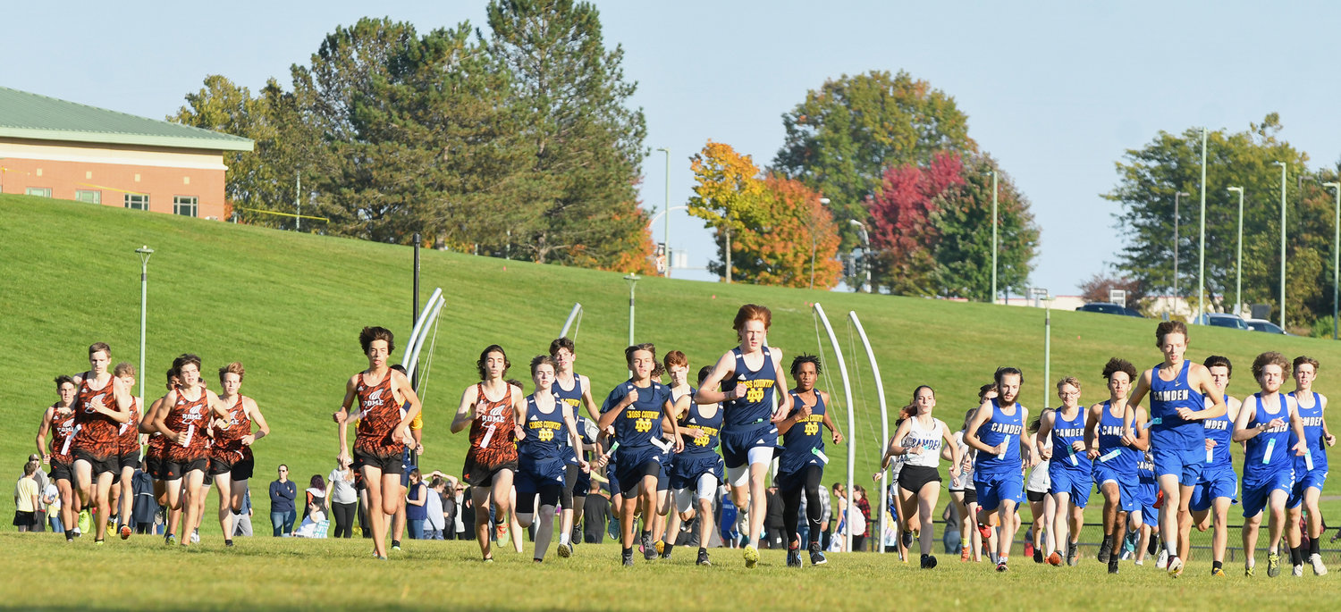 Runners get started at the varsity cross country race at Rome Free Academy on Tuesday, October 11.