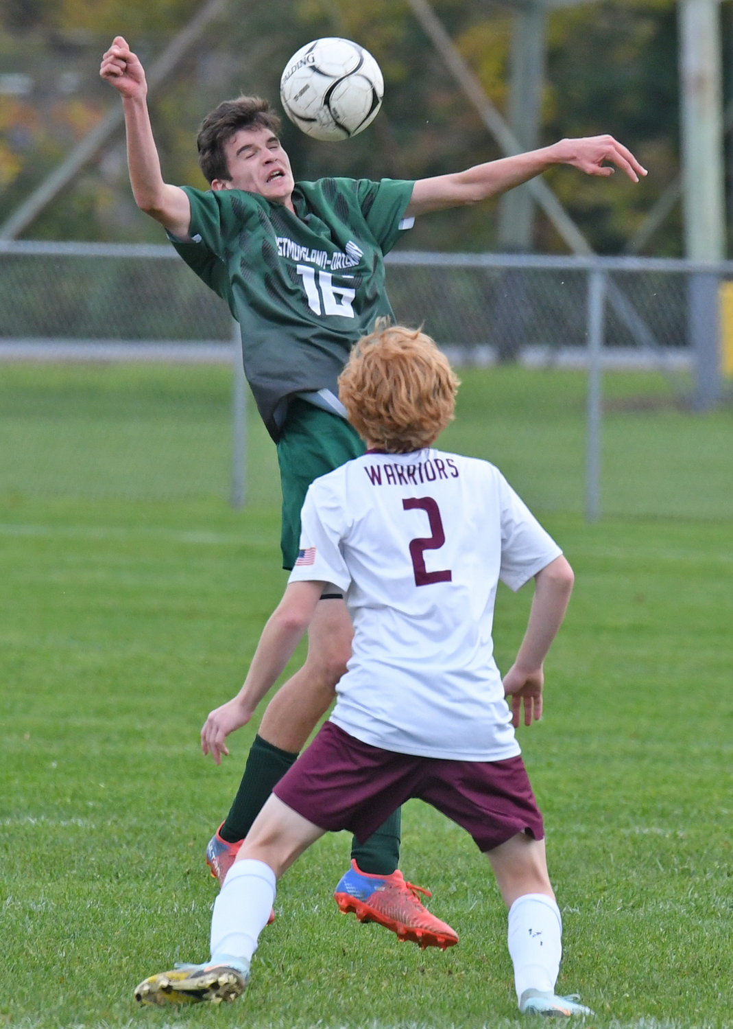 Westmoreland/Oriskany's Riley Smith gets up in the air for the ball in front of Clinton's Henry Schweitzer in the first half Wednesday afternoon in Westmoreland. The host Bulldogs won 2-1 to win the Center State Conference Division I regular season title.