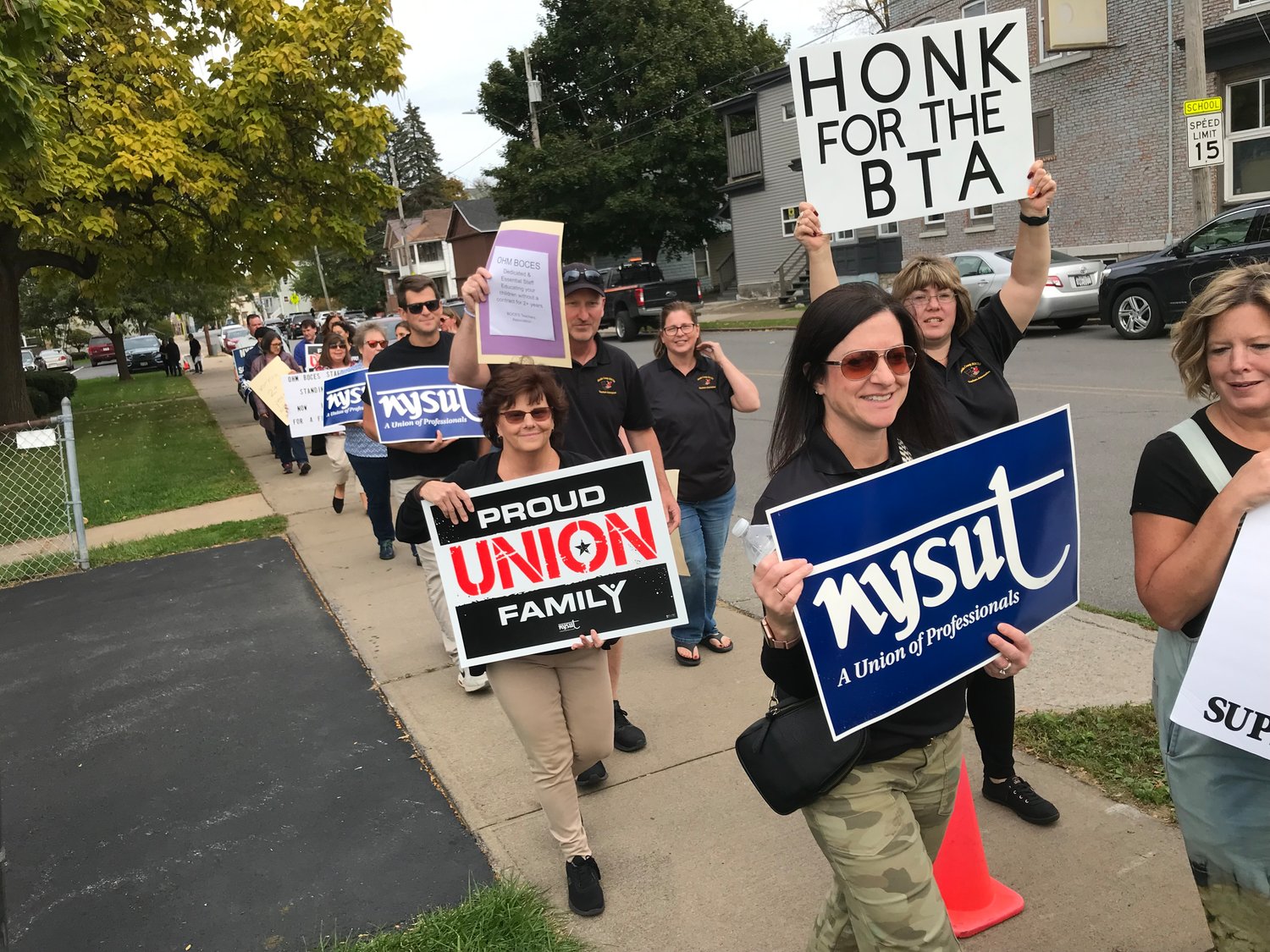 Oneida County BOCES Teachers Association members and supporters picketed Wednesday outside the meeting place of the BOCES Cooperative Board at Middle Settlement Academy on Lincoln Avenue in Utica.
