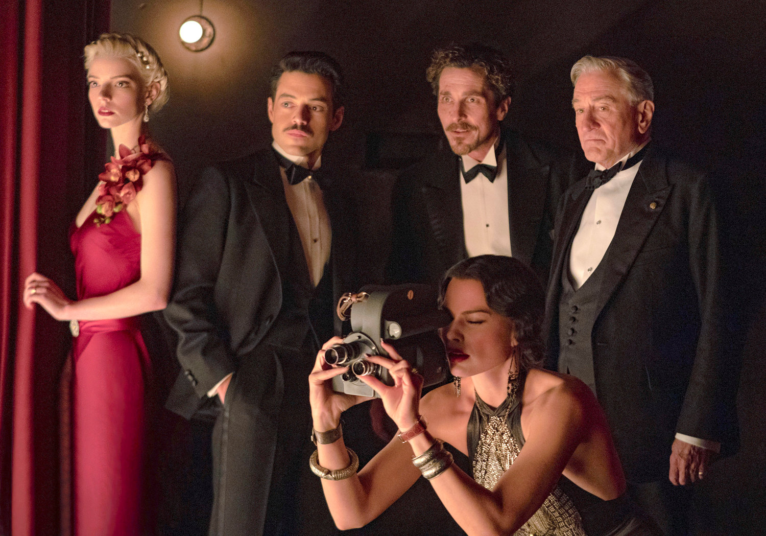 Clockwise from left, Anya Taylor-Joy, Rami Malek, Christian Bale, Robert De Niro and Margot Robbie in a scene from “Amsterdam.”