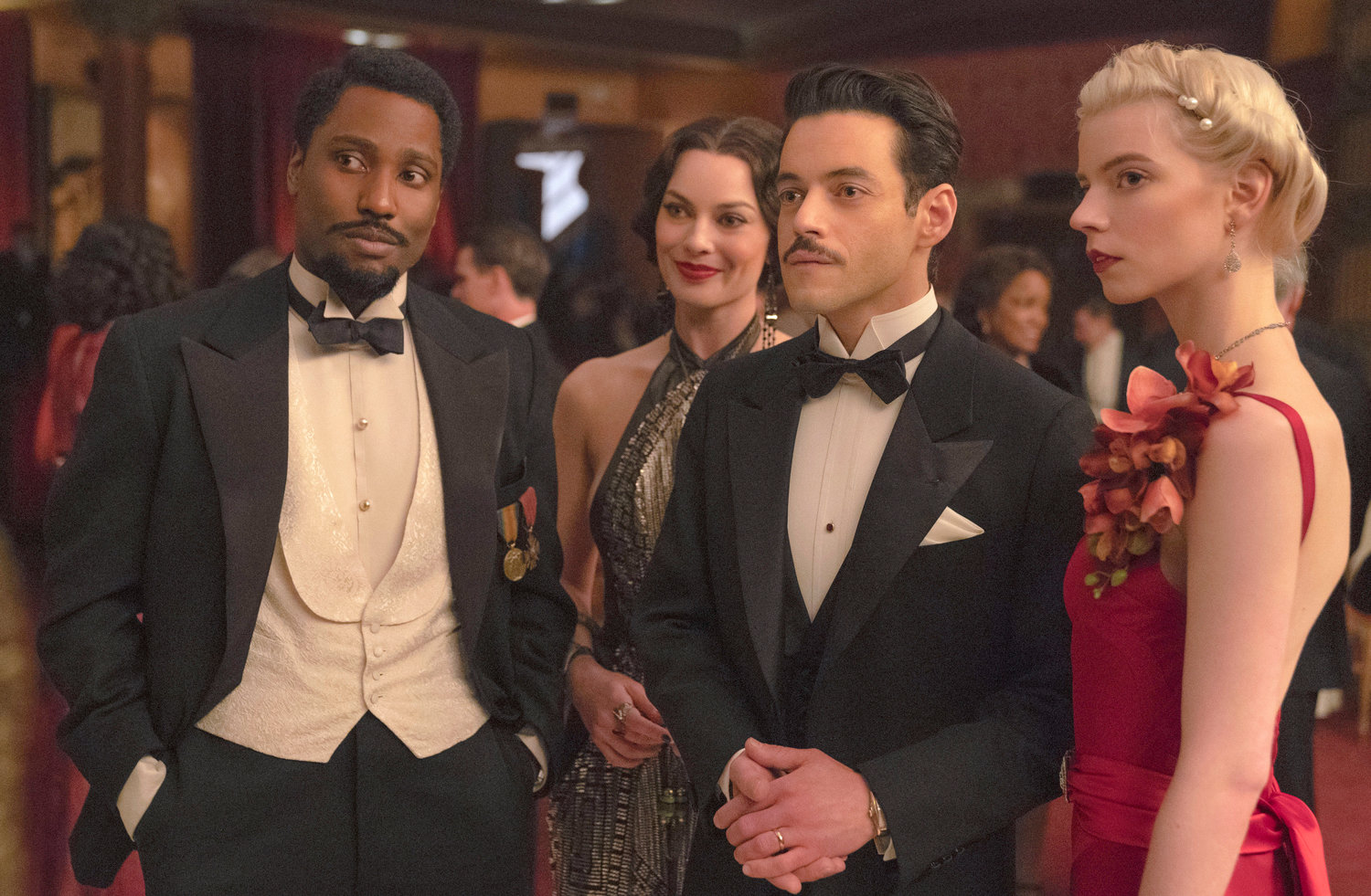 This image released by 20th Century Studios shows, from left, John David Washington, Margot Robbie, Rami Malek and Anya Taylor-Joy in a scene from "Amsterdam." (Merie Weismiller Wallace/20th Century Studios via AP)