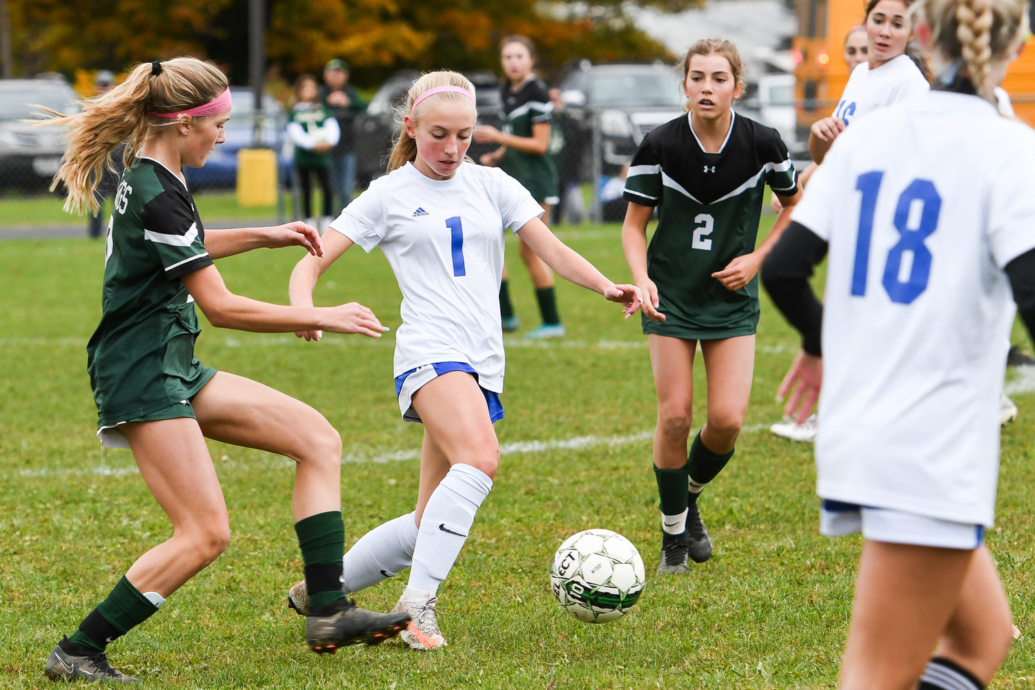 Dolgeville player Emily Metz (1) moves the ball between Westmoreland defenders during the post-season game on Tuesday. Dolgeville won 1-0.