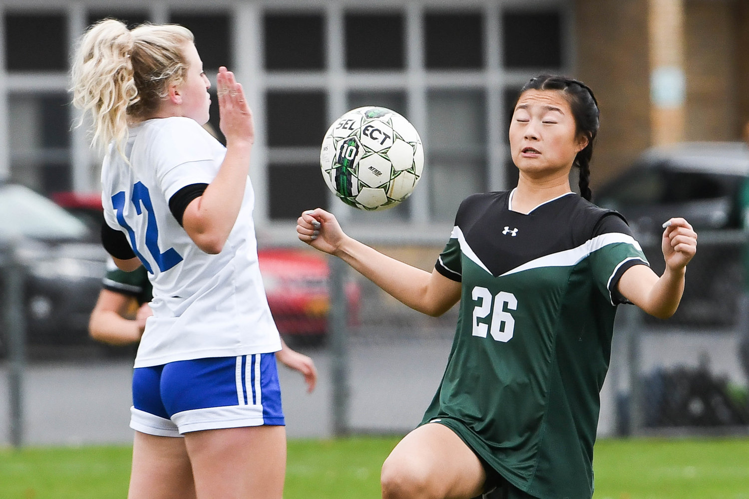 Dolgeville's Gianna Lyon, left, and Westmoreland's Emma Carmody attempt to settle the ball during the Class C playoff game on Tuesday. Dolgeville won 1-0.