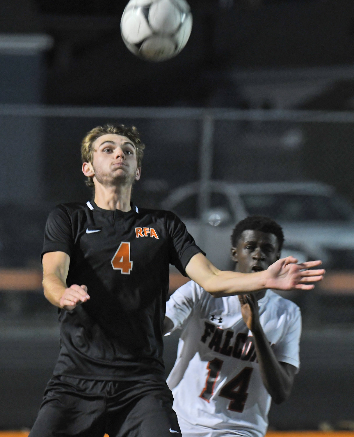 Gavin Civitelli of Rome Free Academy, left, looks to control the ball with Fowler's Simon Irankunda behind him Wednesday night at RFA Stadium. RFA won 1-0 on a late goal to advance to the quarterfinals of the Section III Class AA playoffs.