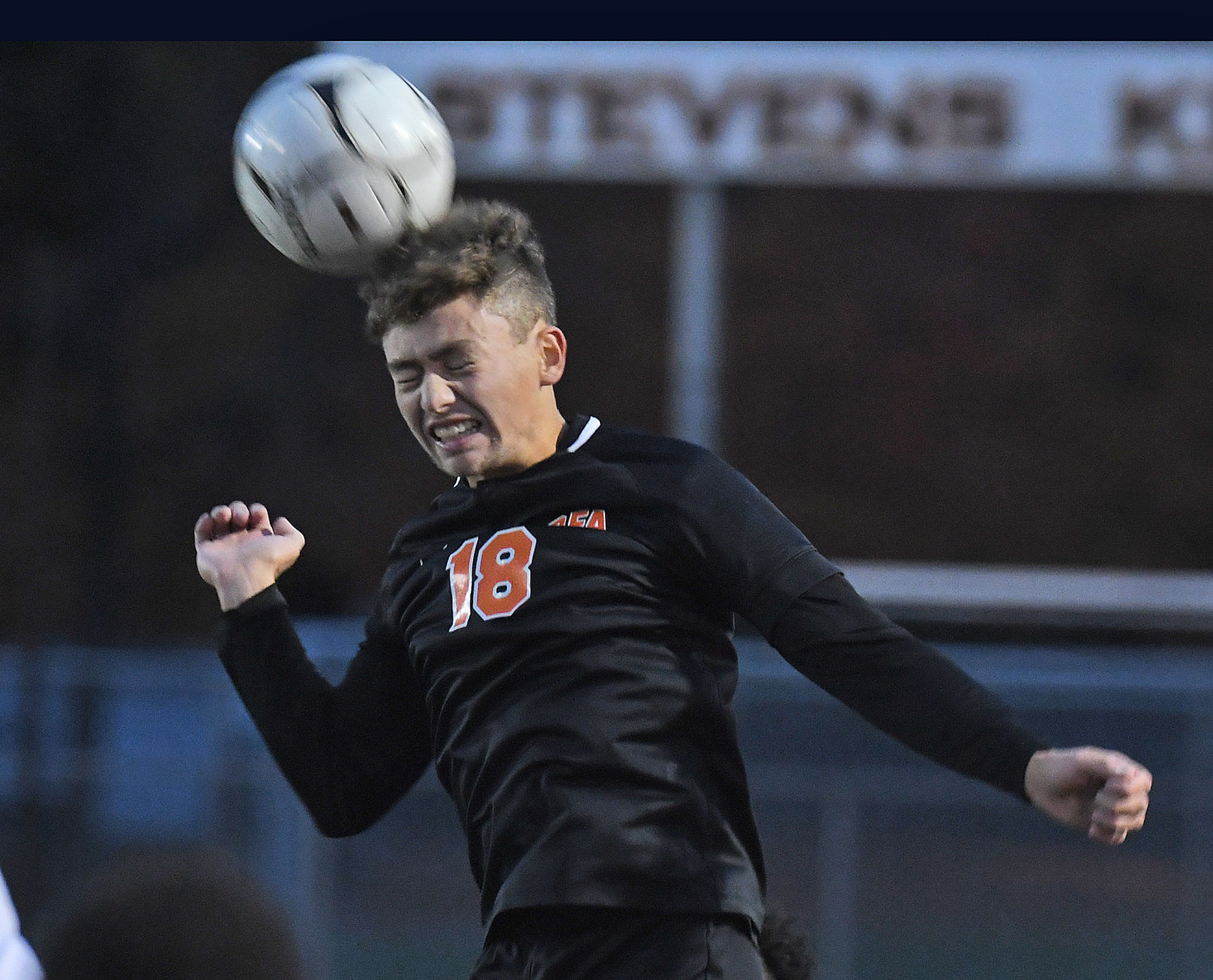 Rome Free Academy's Collin Mummert heads the ball to the middle of the field in the first half against Fowler Wednesday night at RFA Stadium. RFA won 1-0 on a late goal to advance to the quarterfinals of the Section III Class AA playoffs.