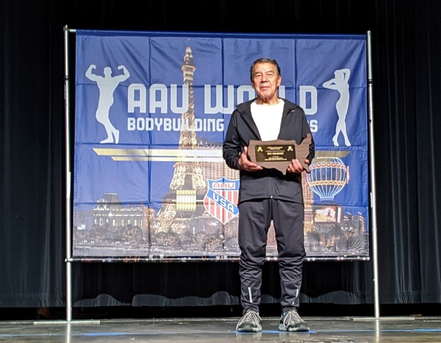 Oneida Indian Nation Member Ray Fougnier receives the 2022 Amateur Athletic Union Strength Sports Overall Male National Athlete of the Year Award following the AAU Powerlifting World Championships held in Las Vegas, Nevada earlier this month. The 79-year-old Fougnier set 27 new world records and earned eight gold medals at the competition.