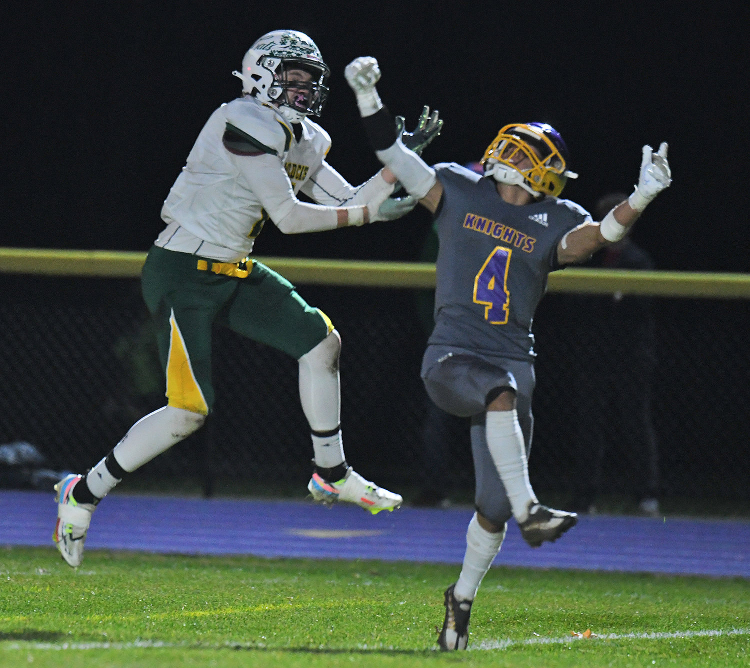 Holland Patent defensive back Anthony Phan tips a pass intended for Adirondack receiver Evan Williams. Phan intercepted the ball as he hit the ground near the goal line to end an Adirondack drive late in the first half. The Wildcats won 46-0 on the road Saturday.