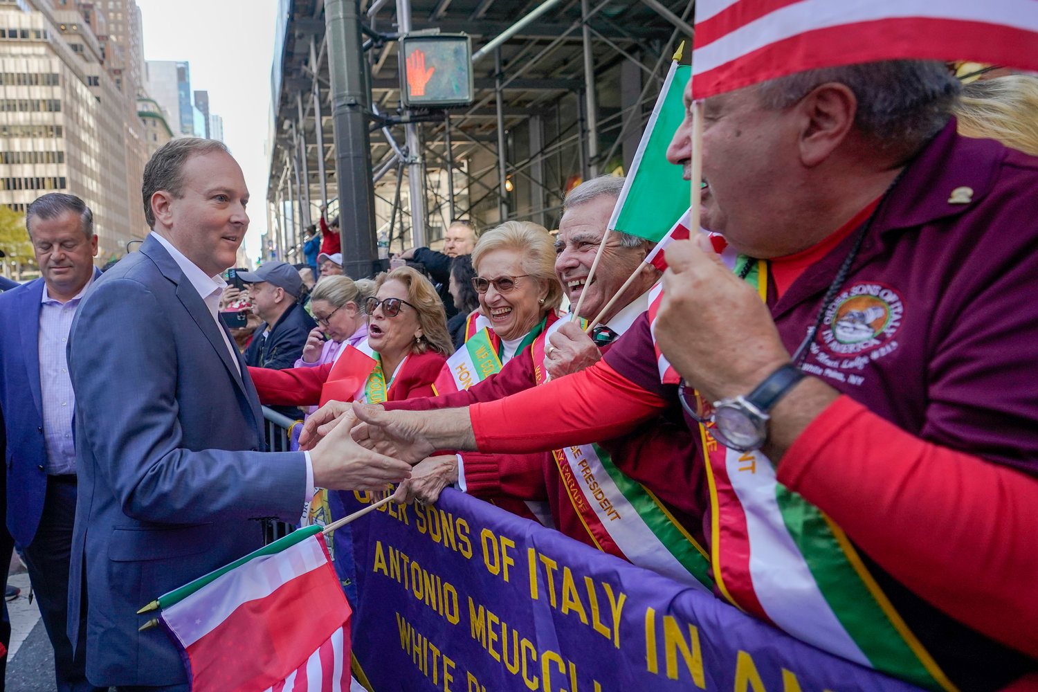 Republican candidate for New York Governor Rep. Lee Zeldin, front left, greets spectators as he marches up 5th Avenue during the annual Columbus Day Parade, Monday, Oct. 10, 2022, in New York.