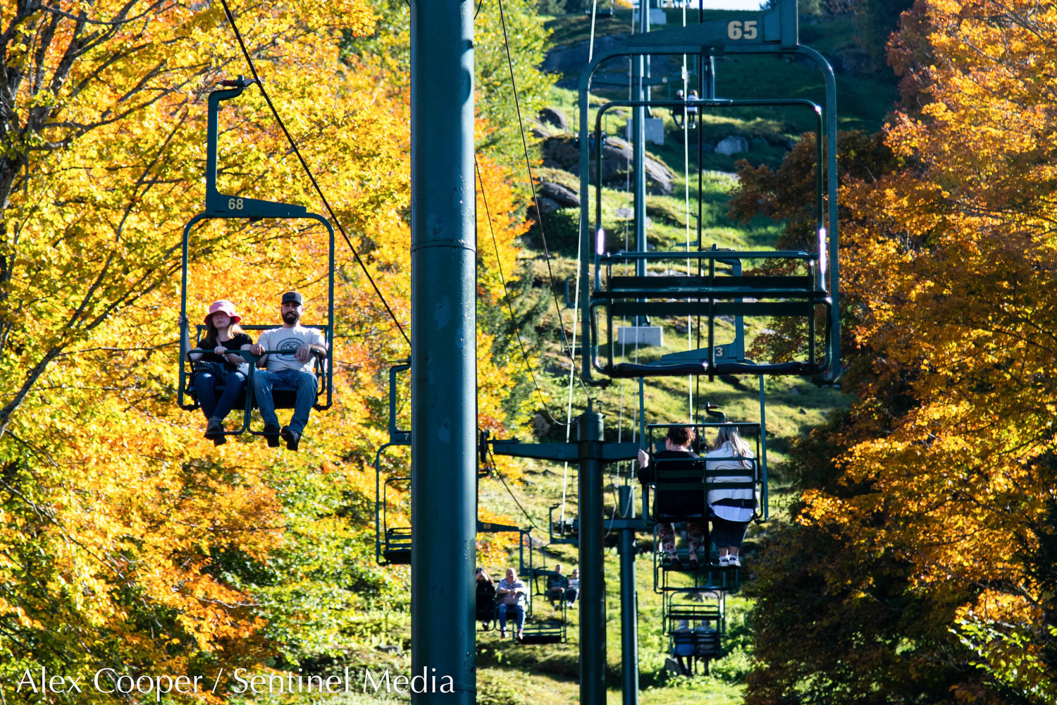 People ride the scenic chairlift ride at McCauley Mountain on Wednesday, Oct. 5 in Old Forge. Guests are able to view peak fall foliage from the lift and top of the mountain.