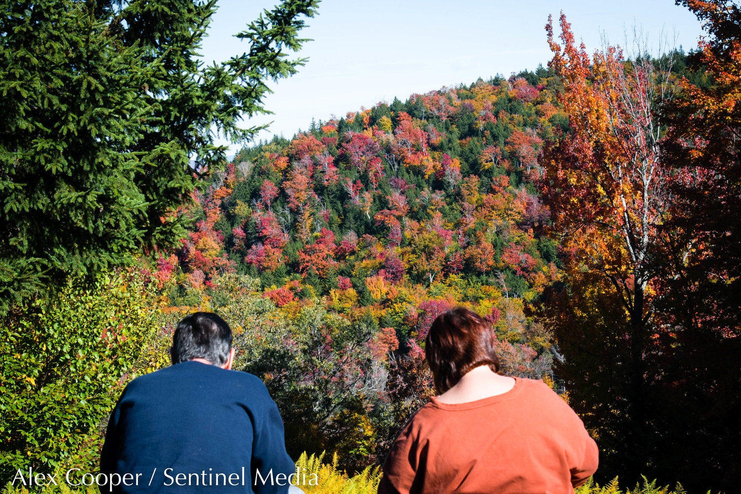 Guests view peak fall folliage from the top of McCauley Mountain on Wednesday, Oct. 5 in Old Forge.