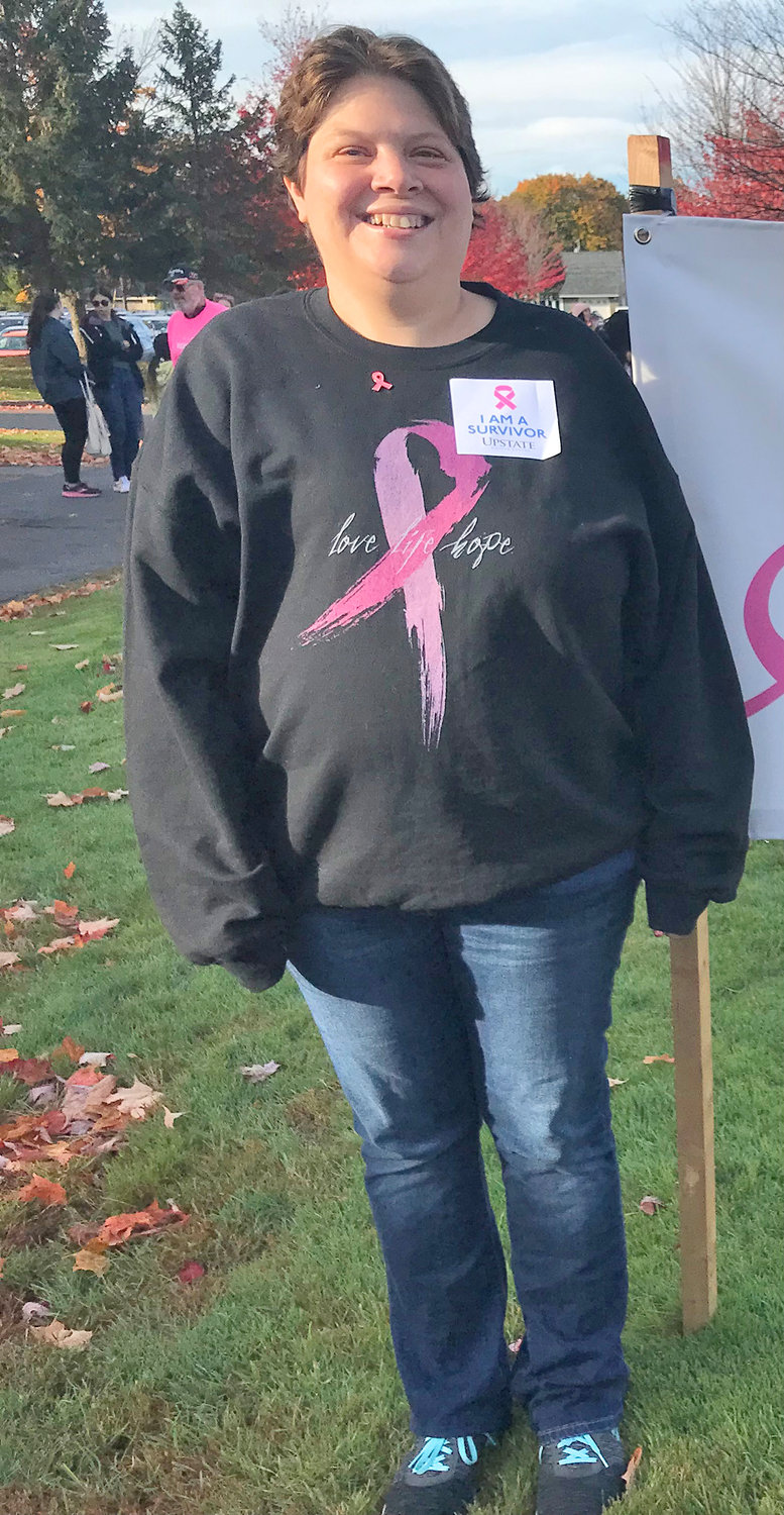 Breast cancer survivor Katie Waltermire prepares for the start of the American Cancer Society’s Making Strides Against Breast Cancer walk Sunday at Mohawk Valley Community College in Utica.