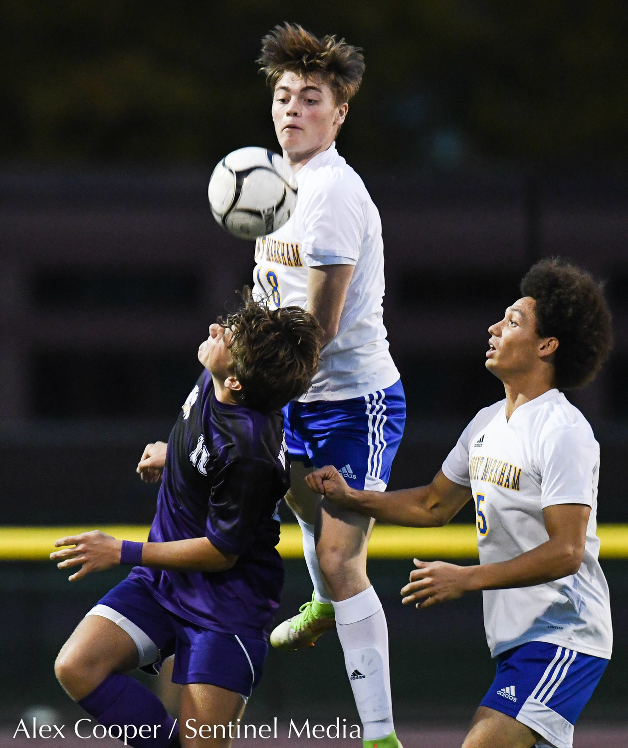 Waterville player Connor Stanton and Mt. Markham players Bryce Lynch and Will Lunny fight for control of the ball during the Class C boys soccer semifinals on Wednesday, Oct. 26 at Canastota.