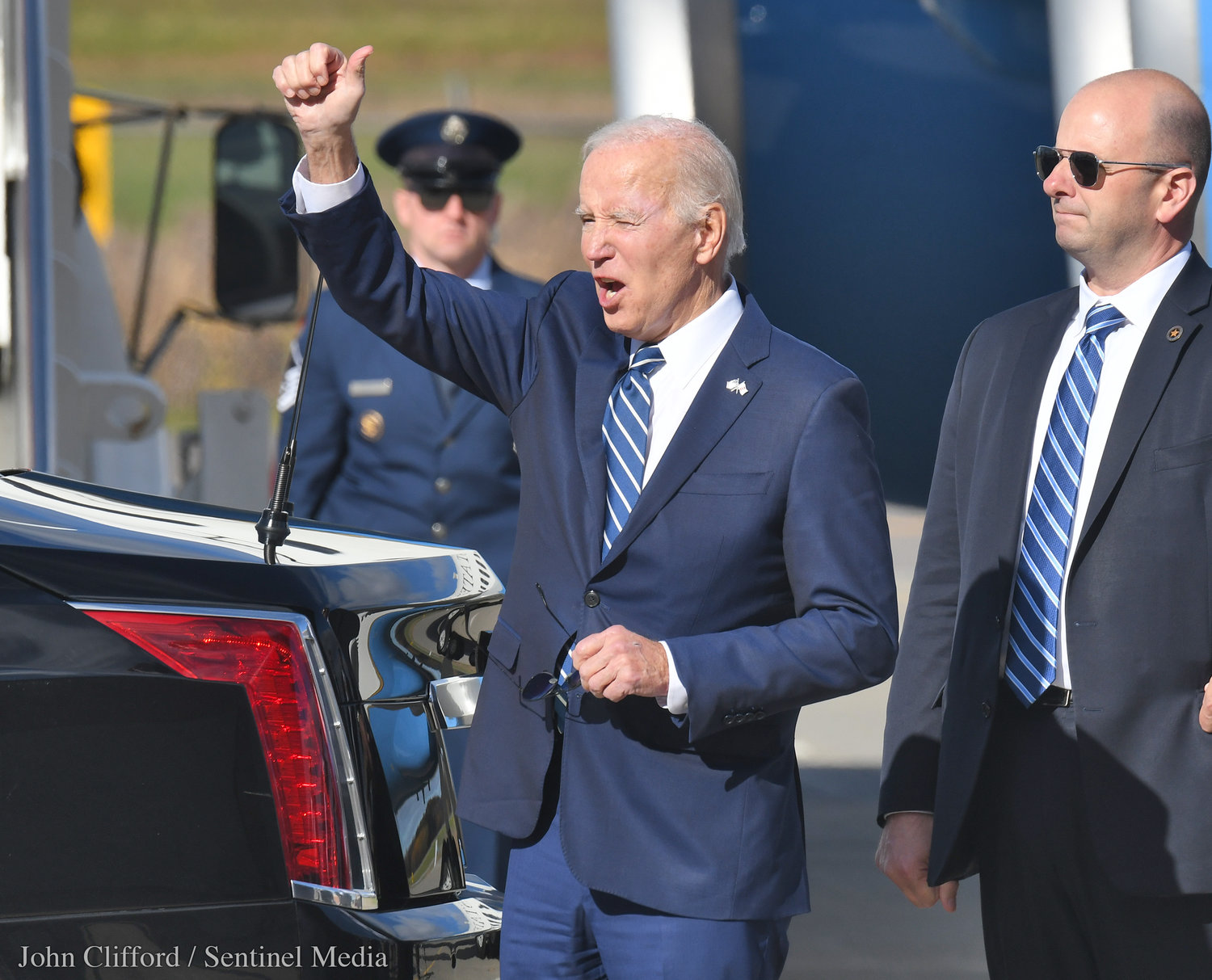 President Joe Biden gives the thumbs up to people that attended his arrival in at Hancock International Airport for his visit to Syracuse Thursday, Oct. 27, 2022.