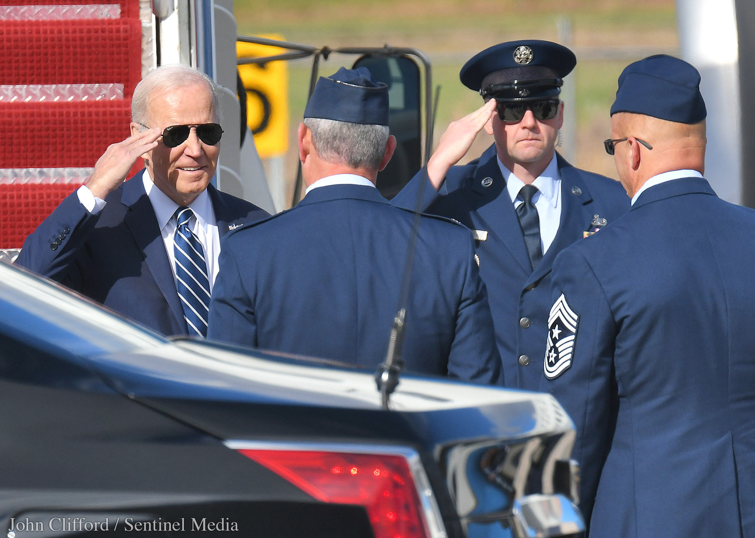 President Joe Biden talks salutes personal after landing at Hancock International Airport for his visit to Syracuse Thursday, Oct.27, 2022.