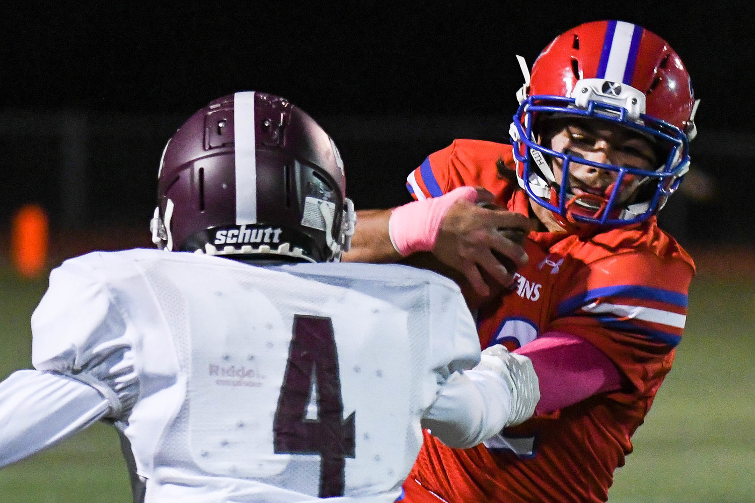 New Hartford running back Angelo Santomassino jukes Corcoran's Jahmere Clarke Friday night in New Hartford. The Spartans won 21-12 to advance to the Section III Class A semifinals.