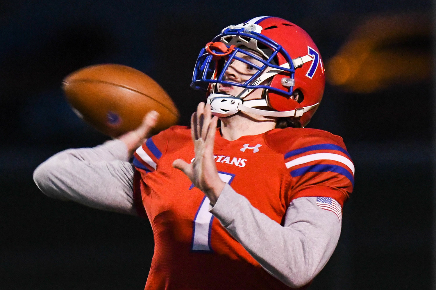 New Hartford quarterback Dominic Ambrose throws a pass during the game against Corcoran on Friday night in New Hartford. Ambrose scored the game's opening touchdown on a short run and the Spartans won 21-12 to advance to the Section III Class A semifinals.