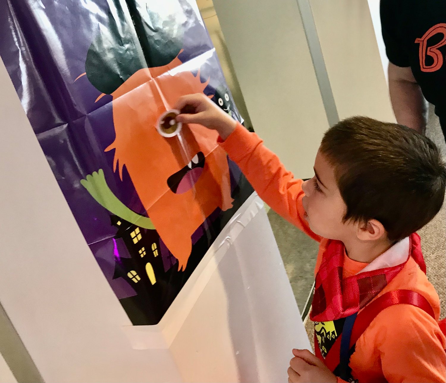 Dominick Rugari of Whitesboro plays pin the nose on the manster Oct. 29 during the Halloween Celebration at Mohawk Valley Community College in Utica.
