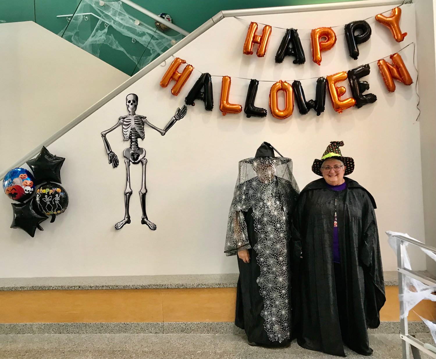 Filly Salsbury, left, and Mary Jo Manno welcome area kids and their chaperones Oct. 29 to the Halloween Celebration at Mohawk Valley Community College in Utica.