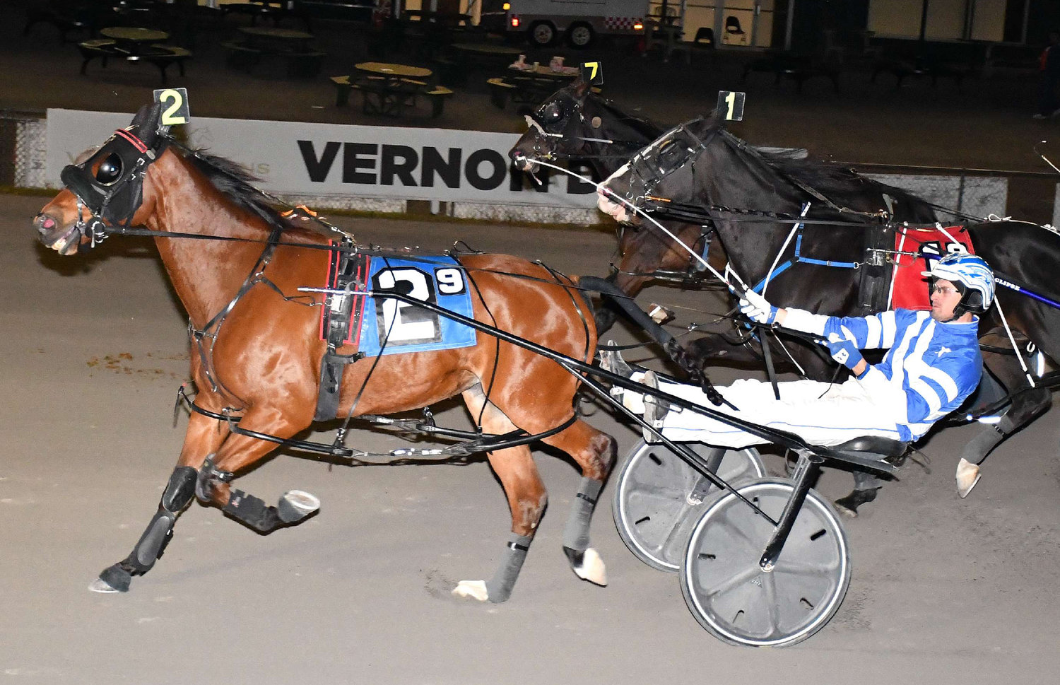 Rub Me and driver Steeven Genois made a late charge to get an upset victory in the $8,700 featured pace at Vernon Downs on Saturday. The 5-year-old gelding got a fifth season victory.