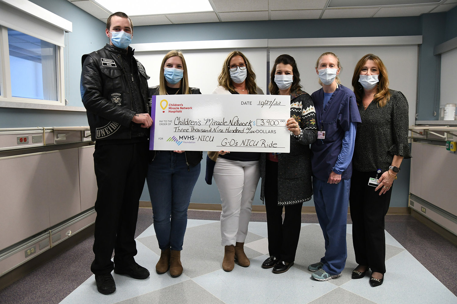 Matt and Shian Acee present a check for $3,400 to the MVHS NICU. (Photo submitted)