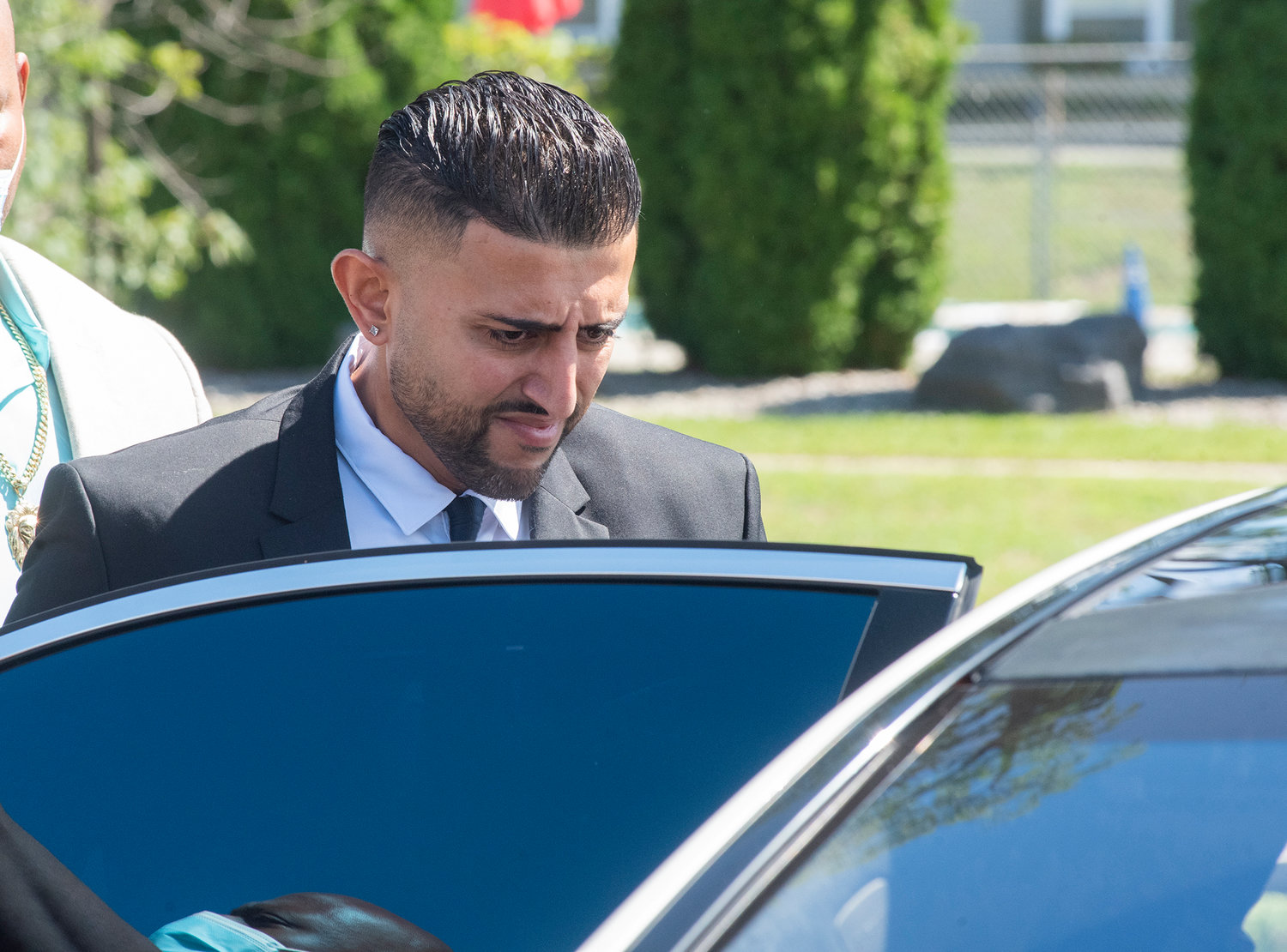 Nauman Hussain enters an awaiting vehicle outside the Schoharie County Courthouse on Wednesday, Aug. 31, after his plea deal was vacated by the judge and a new trial set in the limo crash that killed 20 people.