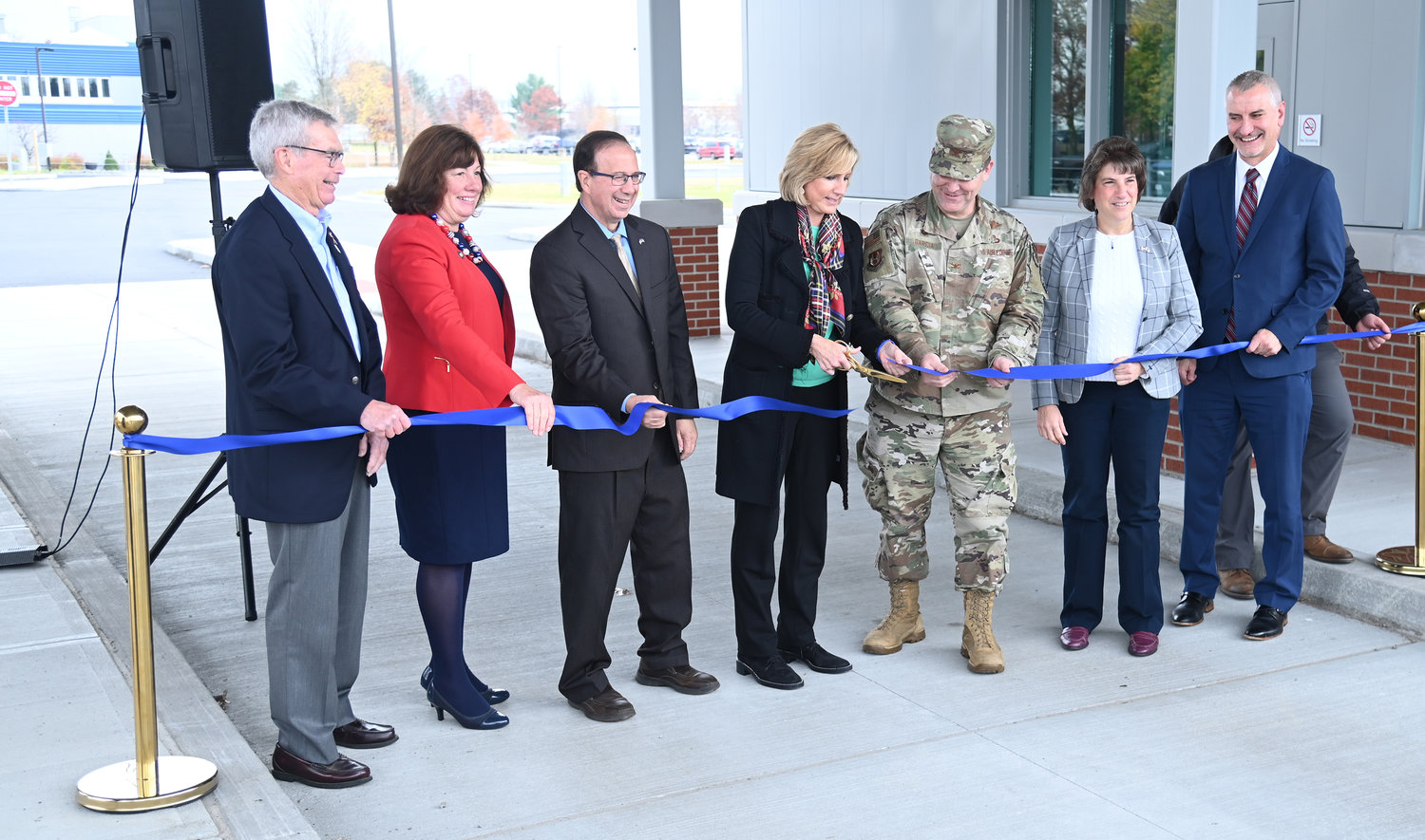 Local dignitaries and Air Force Research Laboratory personnel cut the ribbon on the new $14.8 million visitor control center and security perimeter at the AFRL Tuesday. From left: Don Hanson, retired director of the AFRL Information Directorate; Assemblywoman Marianne Buttenschon, D-119, Marcy; Sen. Joseph A. Griffo, R-47, Rome; Congresswoman Claudia Tenney, R-22, New Hartford; Col. Fred Garcia II, director of the Information Directorate; Mayor Jacqueline M. Izzo; Michael Hayduk, deputy director of the Information Directorate; and at rear, Kyle Davis, project engineer with the U.S. Army Corps of Engineers.